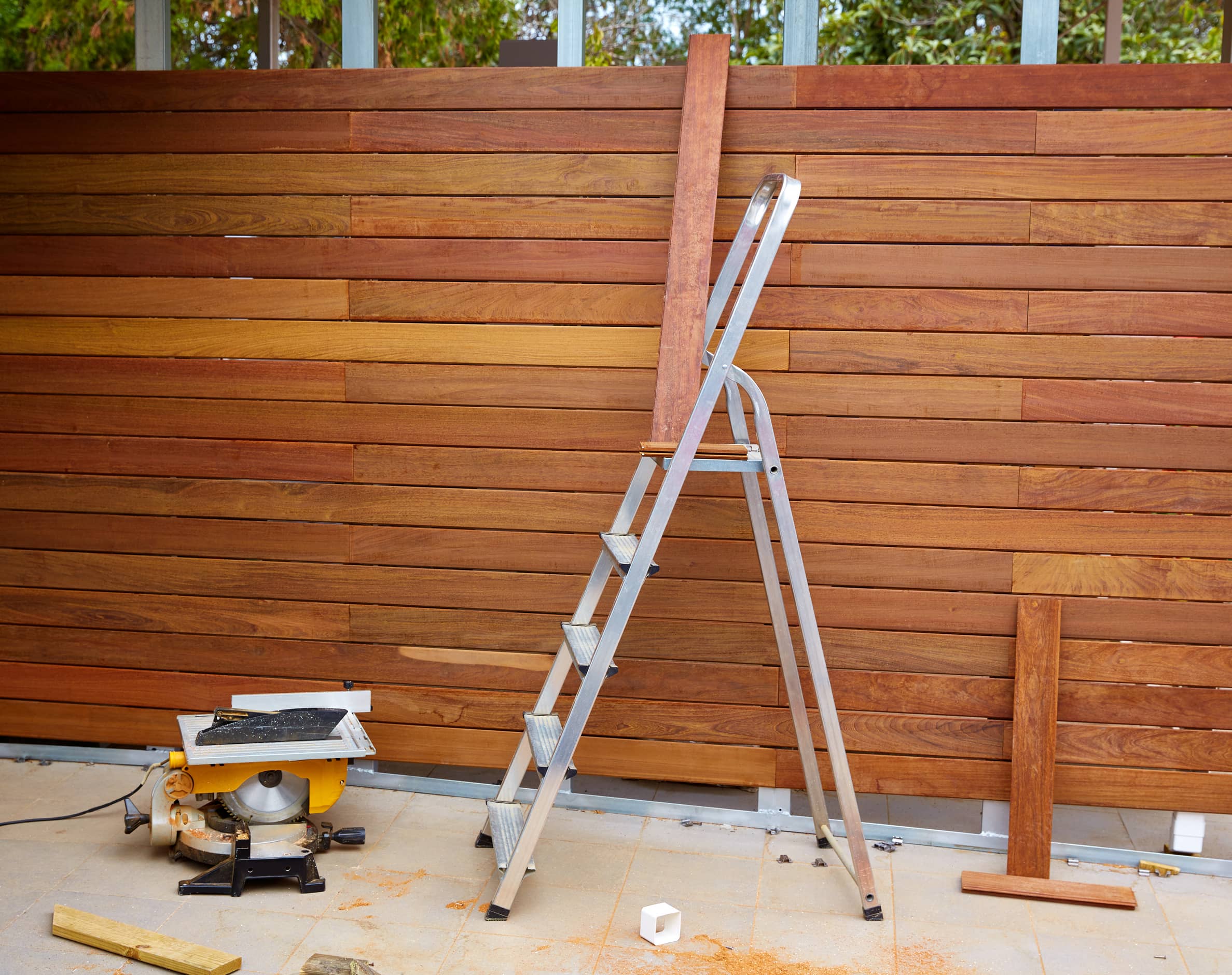 An image of a nearly finished custom wooden fence.